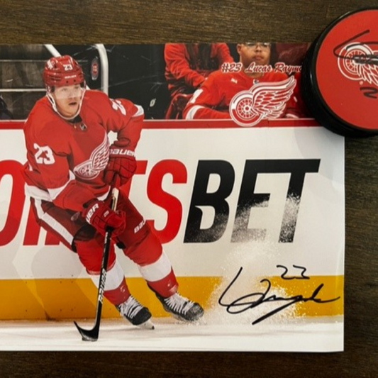 Lucas Raymond (#23) signed puck & photo