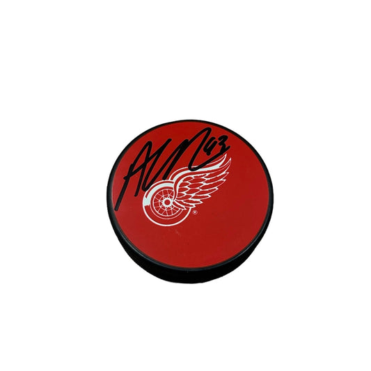 Alex DeBrincat Signed Puck