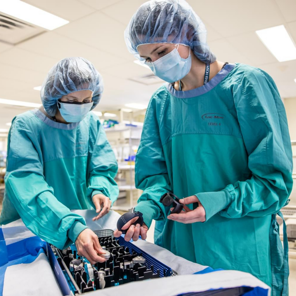 Two Grand River Hospital team members perform medical device reprocessing